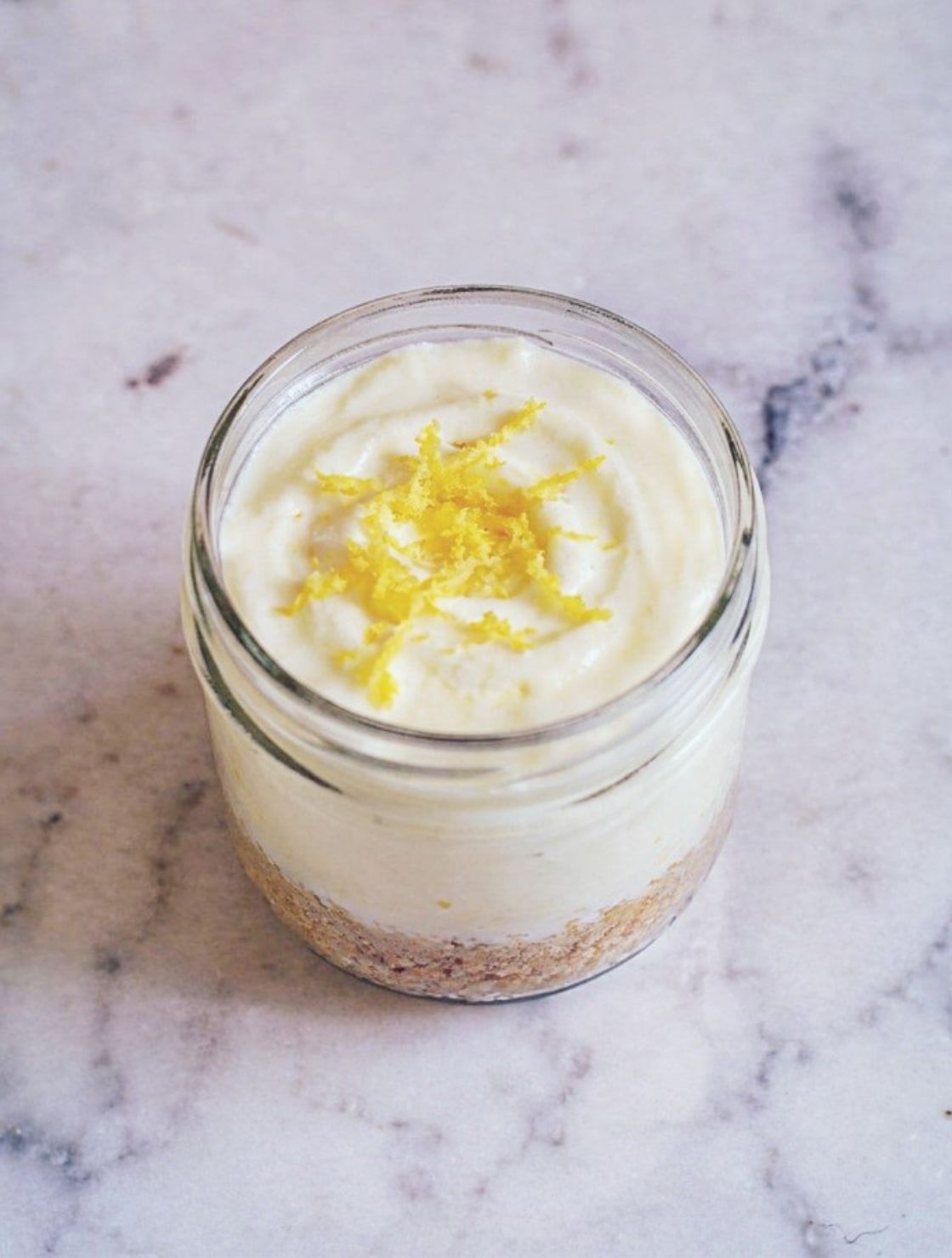 No-Bake Keto Lemon Cheesecake Cups topped with fresh lemon zest