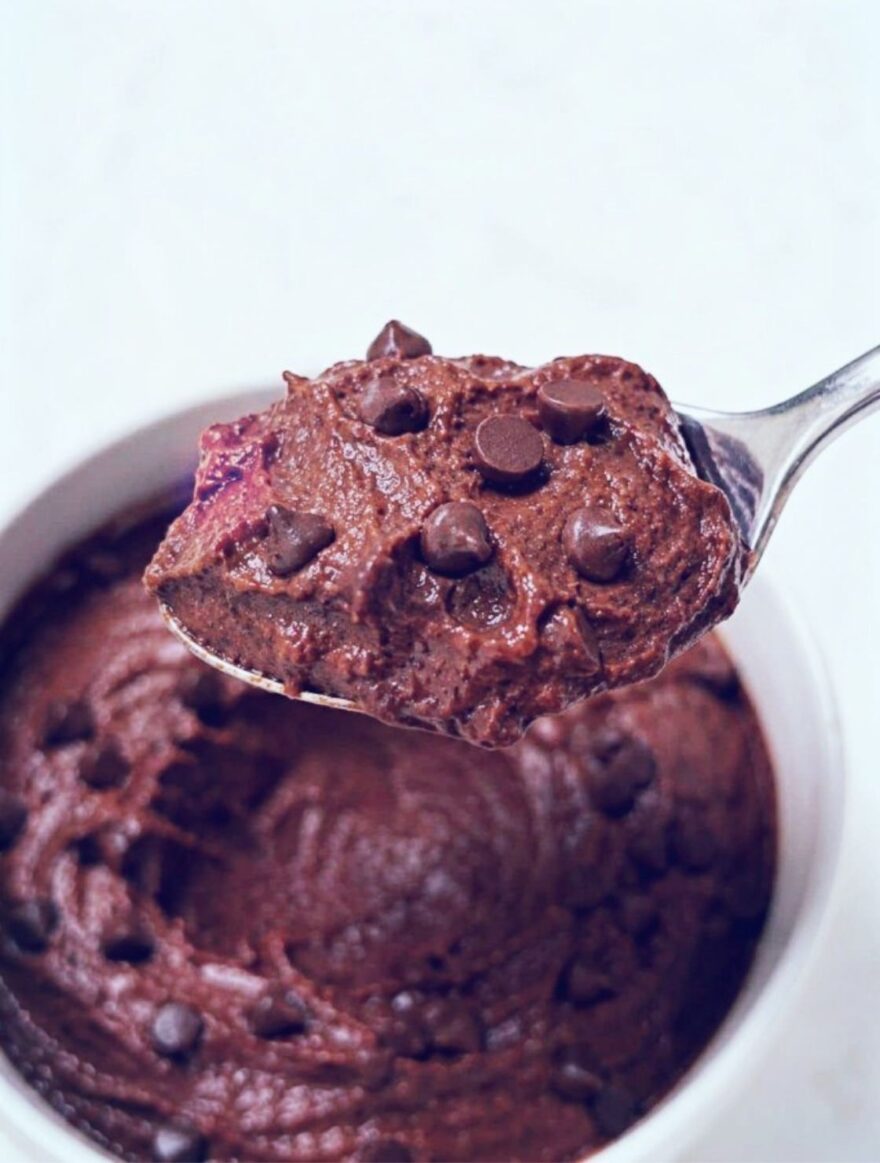 Protein Brownie Batter Dip in a spoon topped with mini chocolate chips