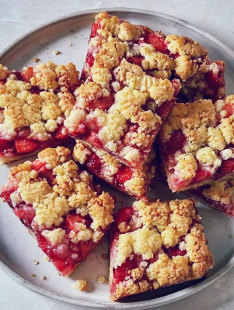 Strawberry Shortcake Cookie Bars, soft chewy strawberry dessert bars with golden crumble topping on creamy plate, homemade summer treat